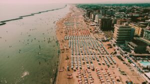 Stunning aerial shot of Igea Marina's crowded beachfront in Emilia-Romagna, Italy.