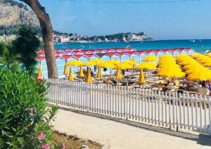 a bunch of umbrellas that are on a beach