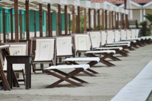 brown wooden folding chairs on gray concrete floor during daytime