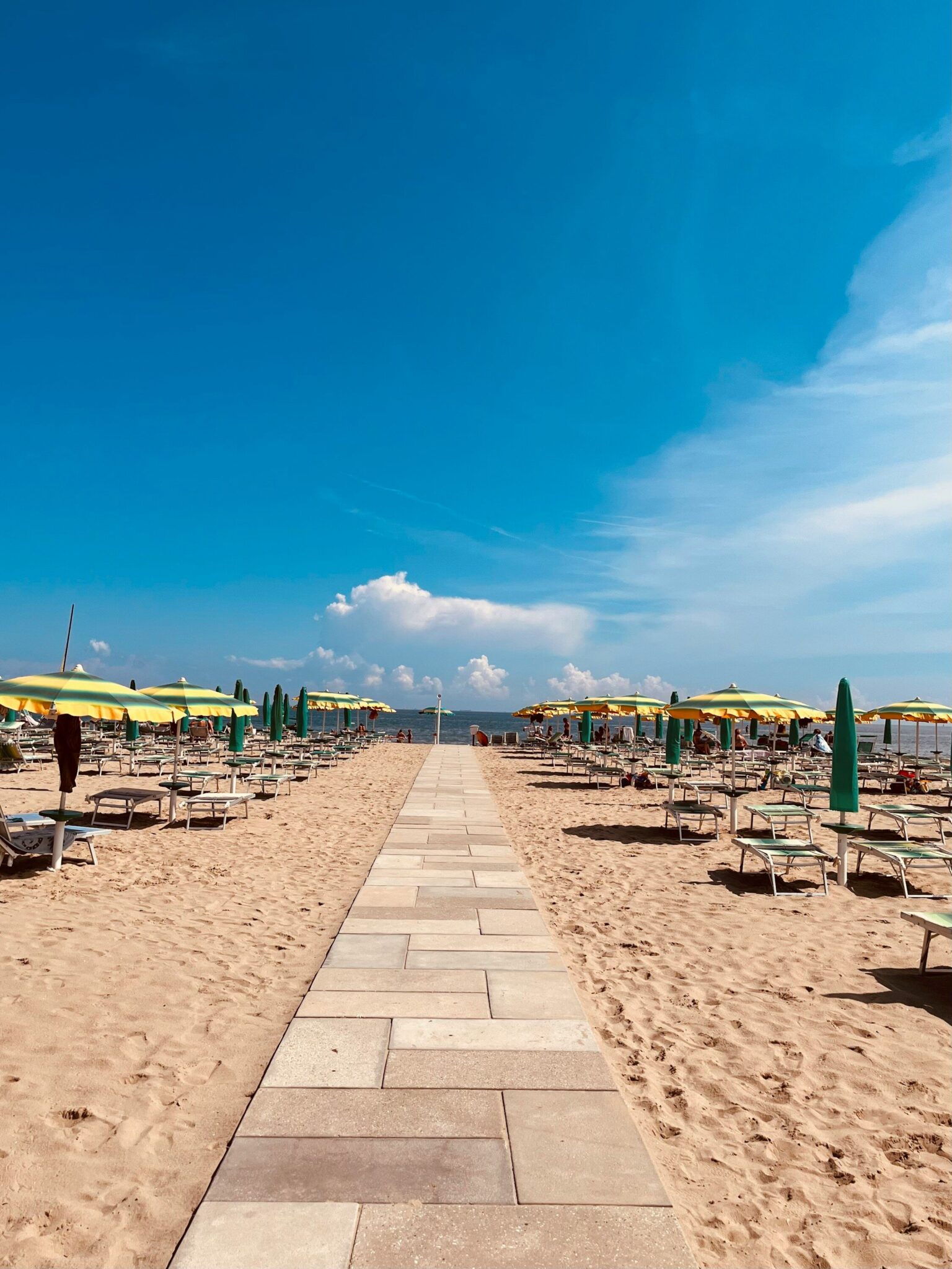 a beach with umbrellas